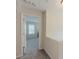 Second floor hallway leads to the bedrooms with neutral paint and carpet at 750 Summerstone Ln, Lawrenceville, GA 30044
