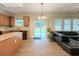 Open concept kitchen featuring hardwood floors, an island, and stainless steel appliances at 750 Summerstone Ln, Lawrenceville, GA 30044