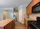 Modern kitchen featuring hardwood floors, granite countertops, and stainless steel appliances at 750 Summerstone Ln, Lawrenceville, GA 30044