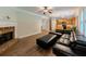 Open concept living room with hardwood floors, fireplace, and seamlessly connected to the kitchen, ideal for modern living at 750 Summerstone Ln, Lawrenceville, GA 30044