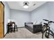 Bedroom with blue walls, table, chairs, and daybed. There is also a bicycle at 898 Oak Sw St # 3204, Atlanta, GA 30310