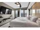 This is a bedroom with a fan, two windows and a big comfy bed with fresh white sheets at 898 Oak Sw St # 3204, Atlanta, GA 30310