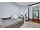Bedroom with blue walls, hardwood floors and a grey daybed with lots of pillows at 898 Oak Sw St # 3204, Atlanta, GA 30310