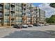 Exterior view of the multi-story apartment building with parking in the foreground at 898 Oak Sw St # 3204, Atlanta, GA 30310