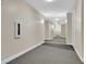 Long hallway with neutral walls, grey carpet and white trim and doors at 898 Oak Sw St # 3204, Atlanta, GA 30310