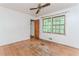 Bedroom featuring hardwood floors, ceiling fan, closet, and natural light from a window at 1913 Flintwood Se Dr, Atlanta, GA 30316