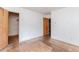 Bedroom featuring hardwood floors, two doorways, and natural light from two windows at 1913 Flintwood Se Dr, Atlanta, GA 30316