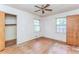 Bedroom featuring hardwood floors, two windows for natural light, and closet space at 1913 Flintwood Se Dr, Atlanta, GA 30316