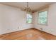 Sunlit dining room with hardwood floors and original details, presenting a blank canvas for a personalized redesign at 1913 Flintwood Se Dr, Atlanta, GA 30316
