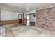 Spacious living room featuring wood paneling and an open doorway to another room at 1913 Flintwood Se Dr, Atlanta, GA 30316