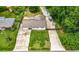 Aerial view showing home with long driveway, and large backyard with green grass and mature trees at 2021 Sherwood Dr Se, Marietta, GA 30062