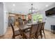 Bright kitchen and dining area featuring stainless steel appliances, tile floor, and sliding doors to the backyard at 2021 Sherwood Dr Se, Marietta, GA 30062