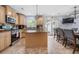 Spacious kitchen with a center island, stainless steel appliances, custom countertops and pendant lighting at 2021 Sherwood Dr Se, Marietta, GA 30062