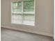 Bright bedroom featuring a large window with natural light and neutral-toned walls at 3522 Estates Landing Nw Dr, Kennesaw, GA 30144