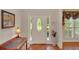 Bright foyer featuring a stylish front door, hardwood floors, and decorative accents at 3522 Estates Landing Nw Dr, Kennesaw, GA 30144