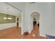 Open foyer with hardwood floors, leading to a dining room and living area with fireplace at 3522 Estates Landing Nw Dr, Kennesaw, GA 30144