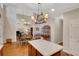 Bright, open kitchen features stainless steel appliances and a view into the living room at 3522 Estates Landing Nw Dr, Kennesaw, GA 30144