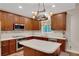 Modern kitchen featuring stainless steel appliances, white countertops, and ample wooden cabinet space at 3522 Estates Landing Nw Dr, Kennesaw, GA 30144