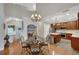 Open concept kitchen with stainless appliances, a center island, and a view of the hardwood foyer at 3522 Estates Landing Nw Dr, Kennesaw, GA 30144
