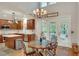 Bright kitchen features a dining area, stainless steel appliances, and access to the deck at 3522 Estates Landing Nw Dr, Kennesaw, GA 30144