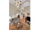 Bright living room featuring an open staircase and hardwood floors at 3522 Estates Landing Nw Dr, Kennesaw, GA 30144