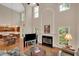 Bright and airy living room with a fireplace and an open floor plan to the kitchen at 3522 Estates Landing Nw Dr, Kennesaw, GA 30144