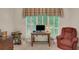 Bright home office with plantation shutters offering a comfortable workspace at 3522 Estates Landing Nw Dr, Kennesaw, GA 30144