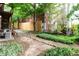 Spacious backyard featuring lush landscaping, a privacy fence and a charming bench at 40 Daniel Se St # 1, Atlanta, GA 30312
