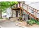 Charming two-story apartment featuring stairs leading to front door with decorative plants surrounding walkway at 40 Daniel Se St # 1, Atlanta, GA 30312