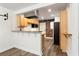 Open-concept kitchen area featuring stainless steel appliances, breakfast bar and exposed brick accent wall at 40 Daniel Se St # 1, Atlanta, GA 30312