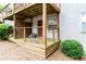 Cozy patio area with wood decking, partial privacy screen and gray painted walls at 40 Daniel Se St # 1, Atlanta, GA 30312