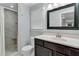 Bathroom featuring a vanity with framed mirror, tile floor and walk-in shower at 209 Breckenridge Ct, Canton, GA 30115