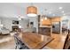 Open-concept dining area adjacent to the kitchen and living room, perfect for Gathering meals and entertaining guests at 209 Breckenridge Ct, Canton, GA 30115