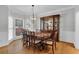 Elegant dining room with hardwood floors, large window, and traditional decor at 209 Breckenridge Ct, Canton, GA 30115