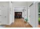 Bright foyer featuring hardwood floors, white trim, and a view into the office, offering a spacious entry at 209 Breckenridge Ct, Canton, GA 30115