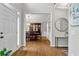 Elegant foyer with hardwood floors, view to dining room, and stylish decor, creating a sophisticated welcome at 209 Breckenridge Ct, Canton, GA 30115