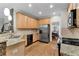 Well-equipped kitchen with stainless steel appliances, hardwood floors, and stone accents, designed for convenience at 209 Breckenridge Ct, Canton, GA 30115