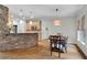 Open concept kitchen with stone breakfast bar and stainless steel appliances at 209 Breckenridge Ct, Canton, GA 30115