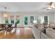Bright living room with hardwood floors, lots of windows, and comfortable seating at 209 Breckenridge Ct, Canton, GA 30115