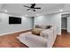 Cozy living room with a large sectional sofa, flat screen tv, and a comfortable sectional sofa at 209 Breckenridge Ct, Canton, GA 30115