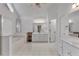 Bright main bathroom with dual sinks, tub, shower and white tile floors at 209 Breckenridge Ct, Canton, GA 30115