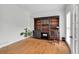 Bright office space with hardwood floors, built-in shelving, and natural light at 209 Breckenridge Ct, Canton, GA 30115