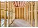 Unfinished basement with exposed studs and concrete floor at 2551 Kilgore Rd, Buford, GA 30519