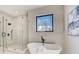 Relaxing bathroom with standalone tub, glass shower, and modern fixtures at 2551 Kilgore Rd, Buford, GA 30519