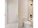 Bathroom with a toilet, shower, and modern fixtures at 2551 Kilgore Rd, Buford, GA 30519
