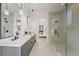 Modern bathroom featuring a double sink vanity, stylish lighting, and a glass-enclosed shower at 2551 Kilgore Rd, Buford, GA 30519