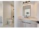 Bathroom with a single sink vanity and modern fixtures at 2551 Kilgore Rd, Buford, GA 30519