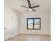 Bright bedroom with hardwood floors, ceiling fan, and natural light at 2551 Kilgore Rd, Buford, GA 30519