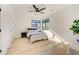 Bedroom with bright natural light, fan, neutral rug and a calming color palette at 2551 Kilgore Rd, Buford, GA 30519