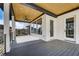 Outdoor deck with plank flooring, ceiling fan, and wooded views at 2551 Kilgore Rd, Buford, GA 30519